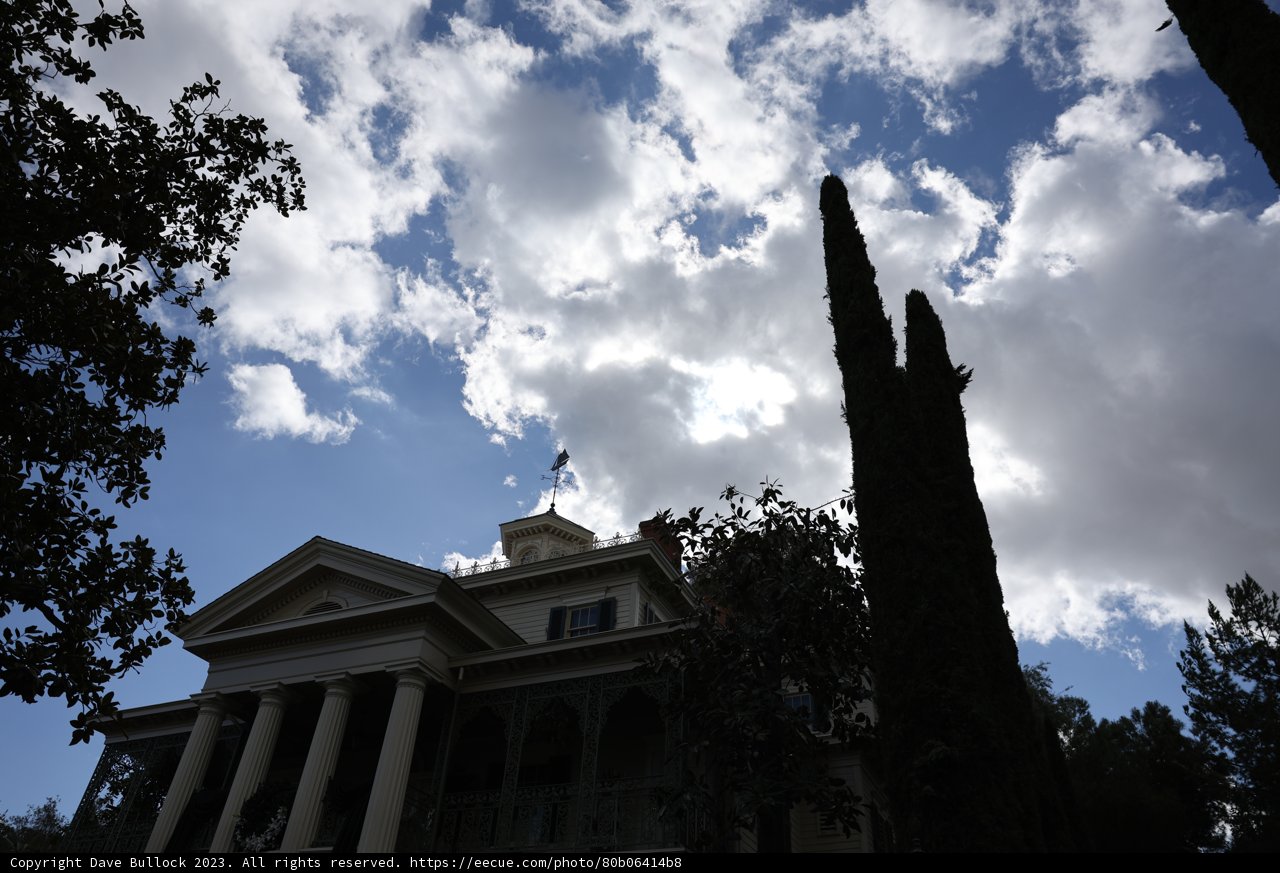 The Iconic Mansion at Disneyland Against a Beautiful Skyline