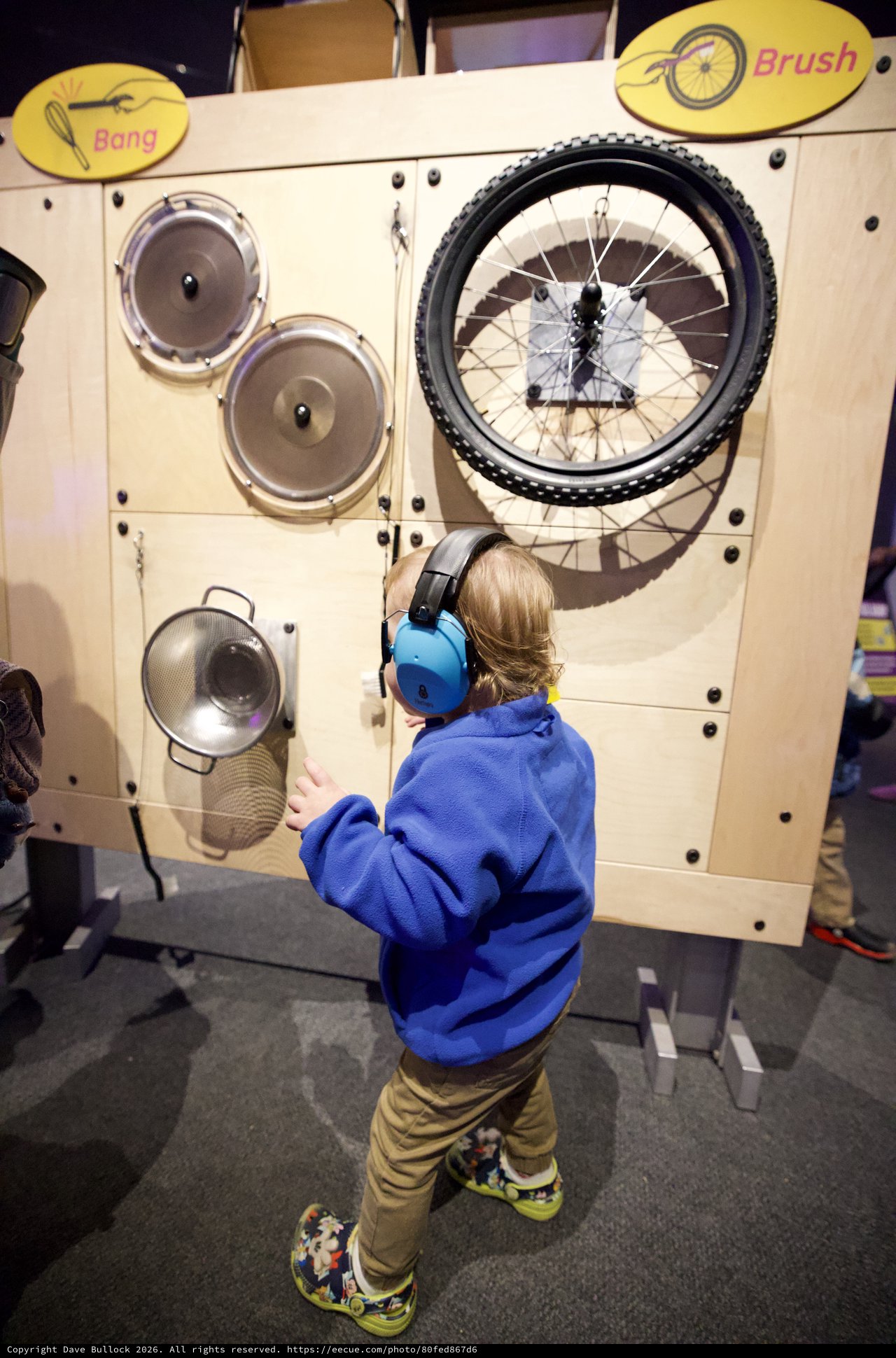 Child Explores Interactive Sound Exhibit at Museum