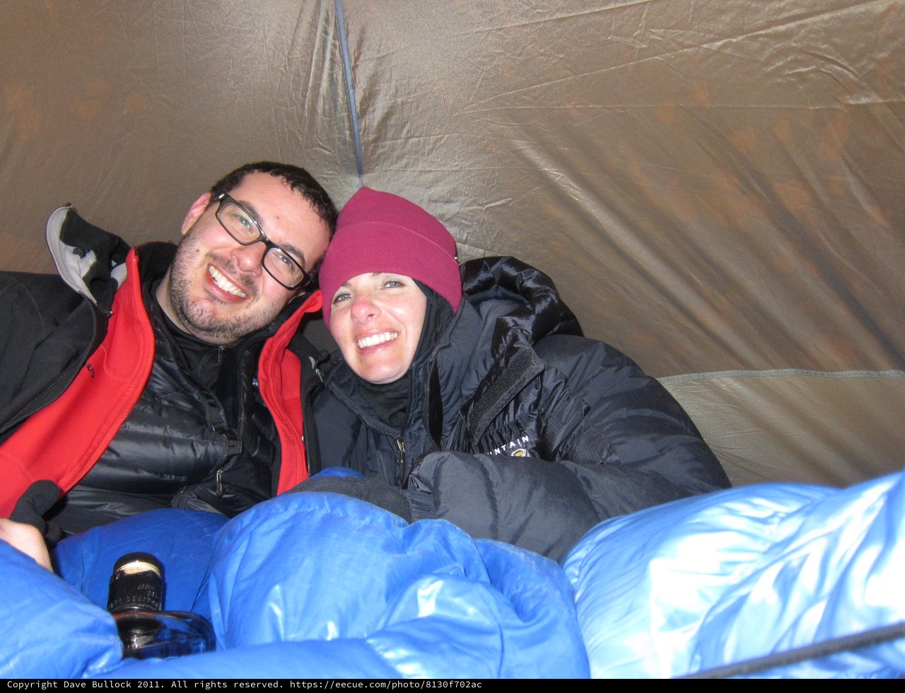 Cozy Couple Smiling Inside Camping Tent Together