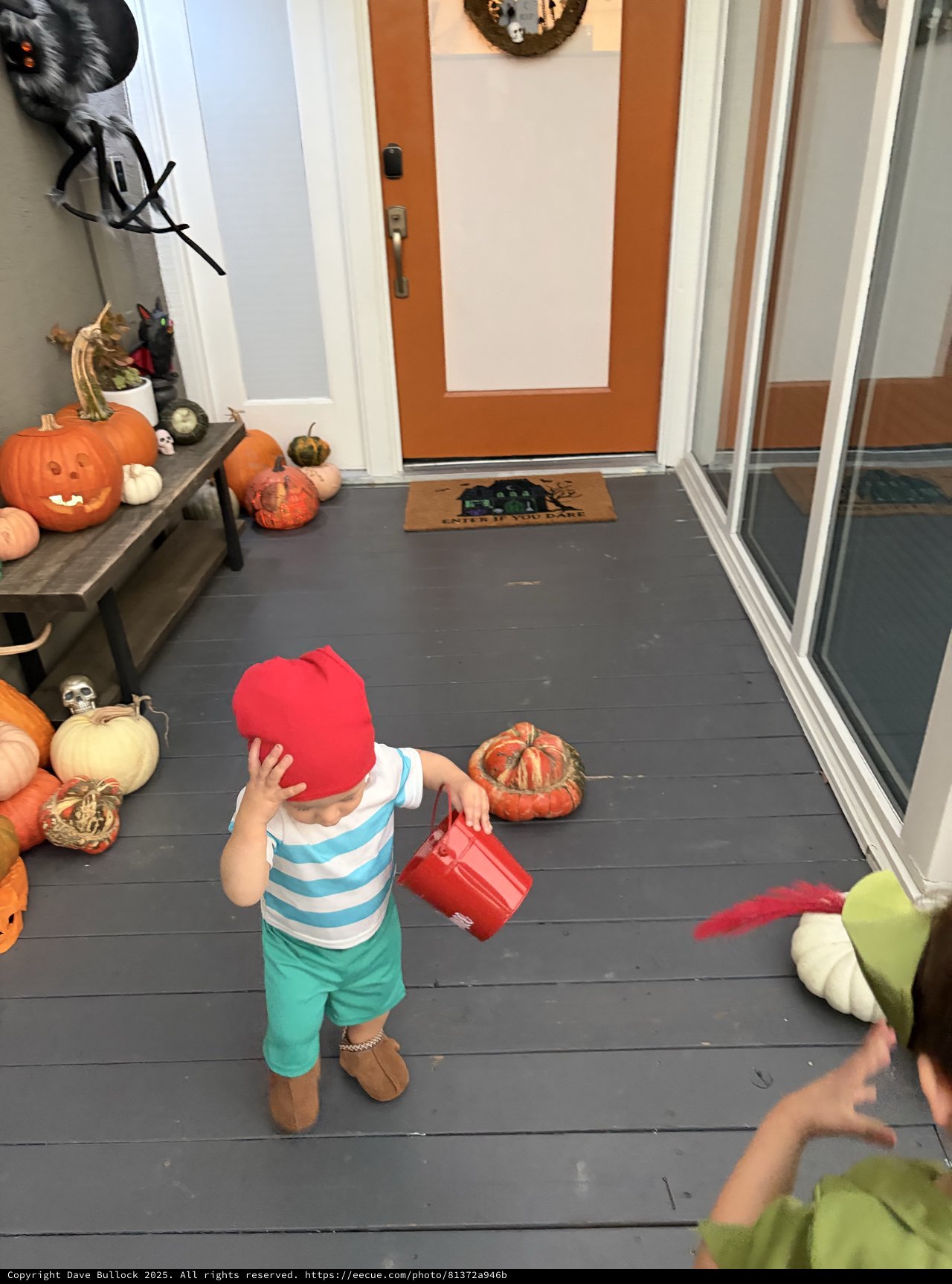 Toddler in Halloween Costume at Festive Front Porch