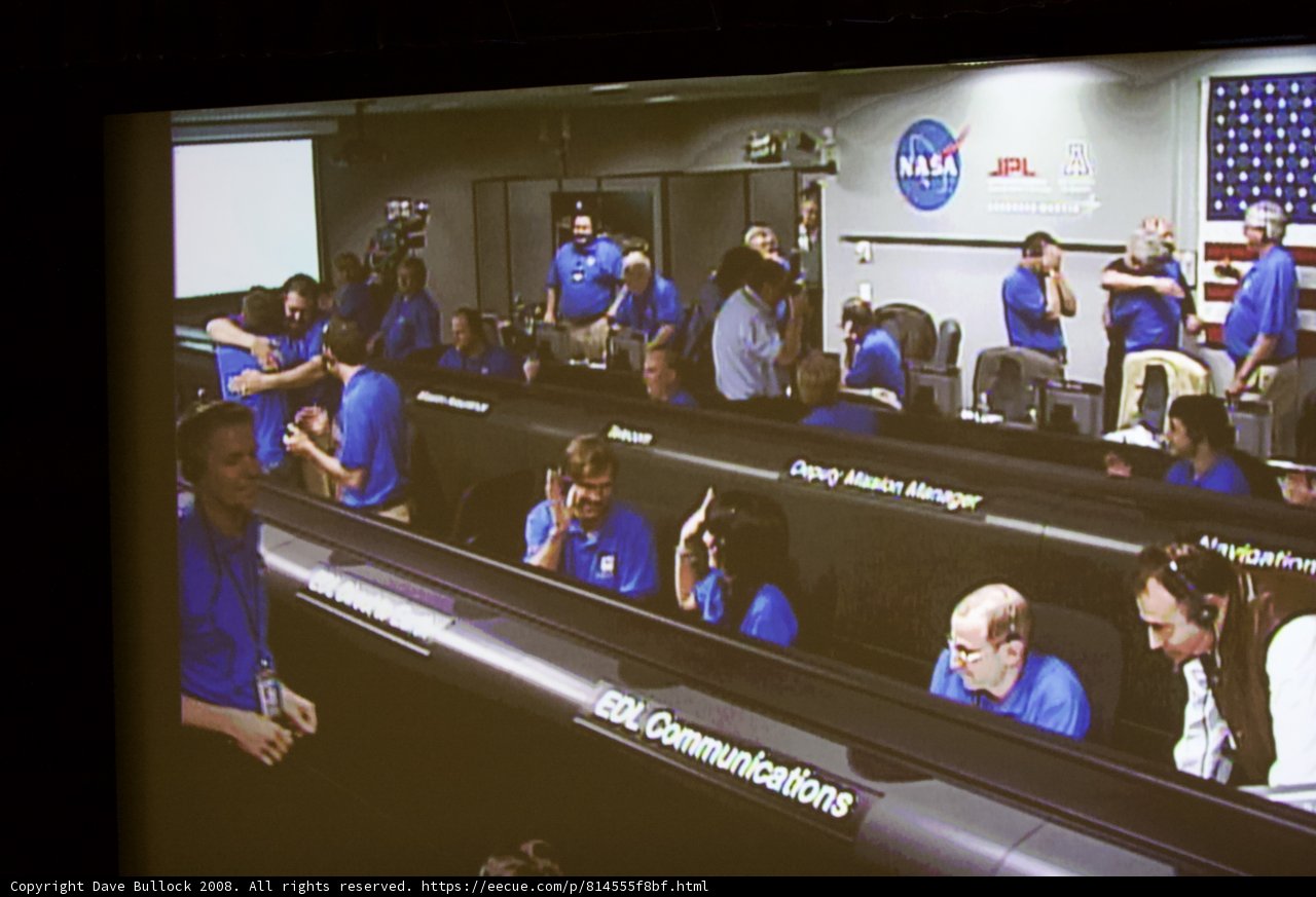 Blue Shirt People Gathering in a Room