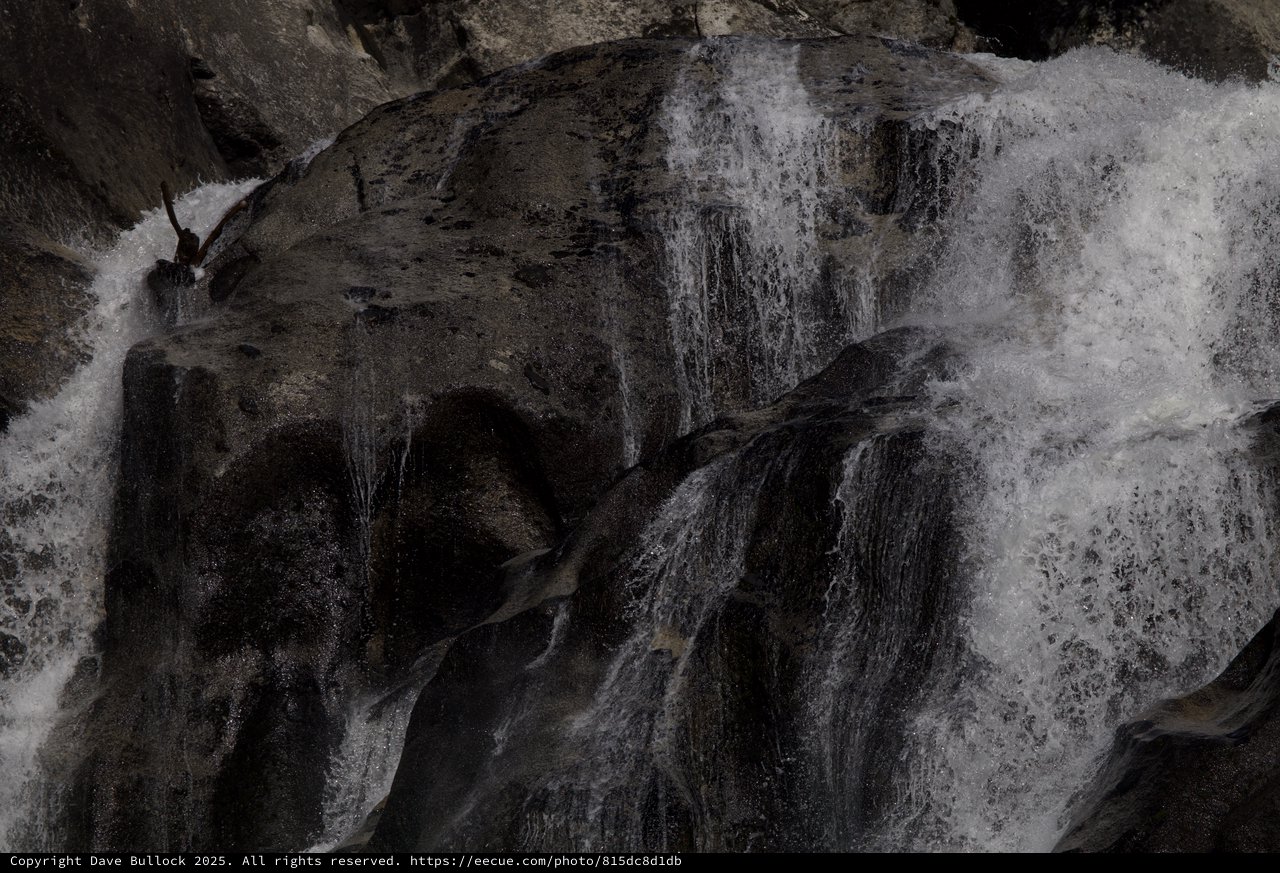 Kayaker Navigating Powerful Winter Waterfall in Yosemite