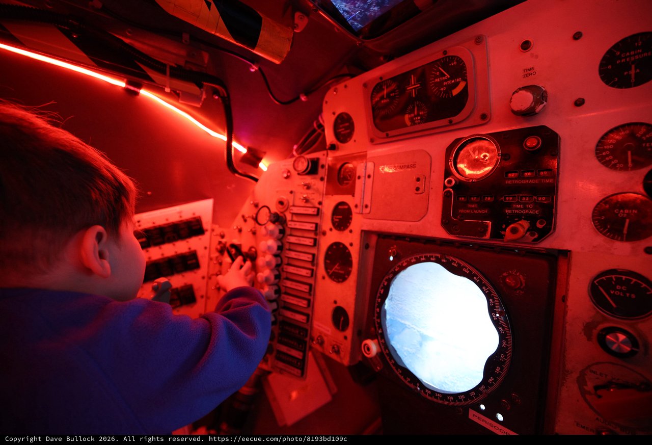 Navigator Operating Submarine Periscope Under Red Light