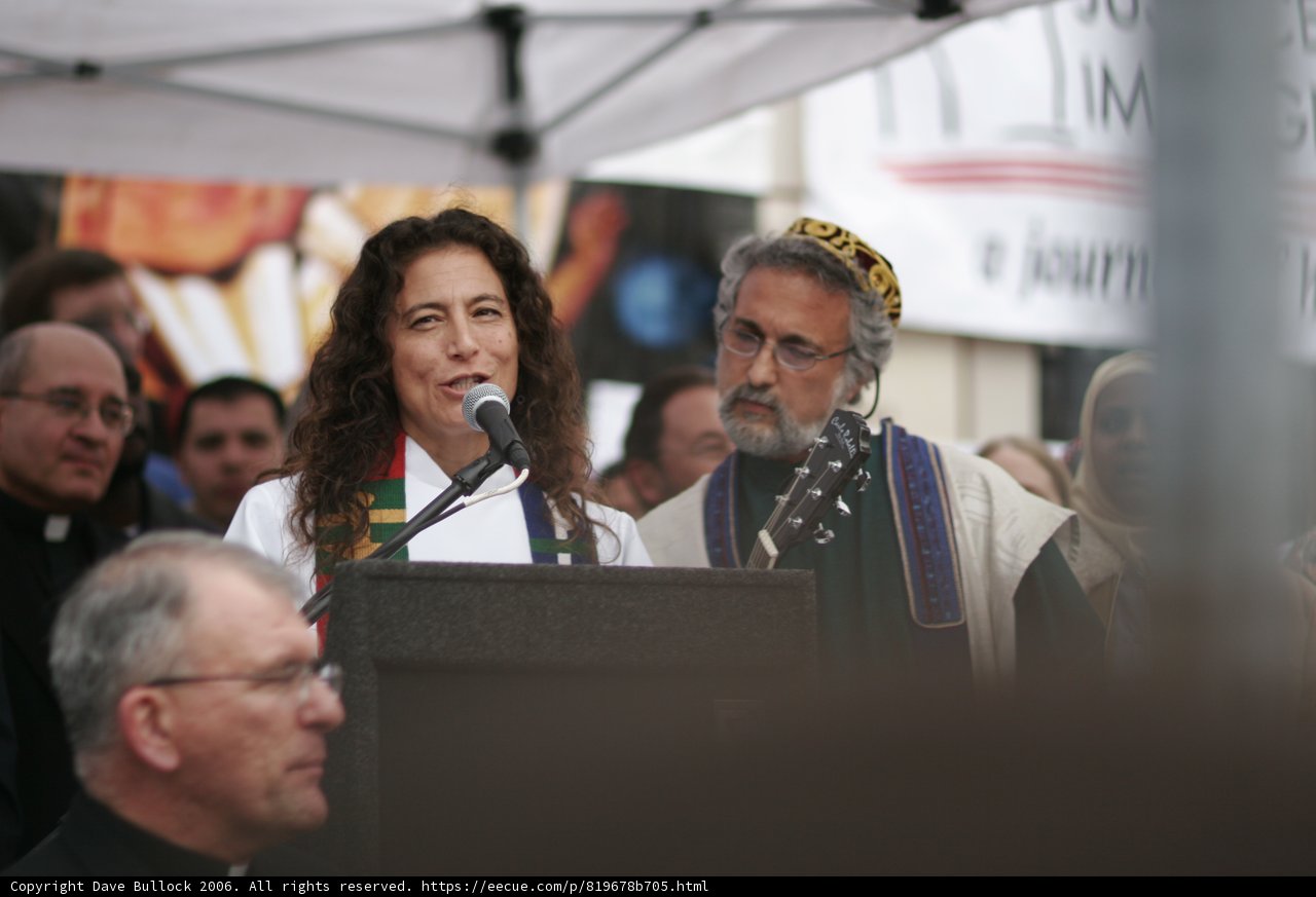 Woman Delivering a Speech at a Podium