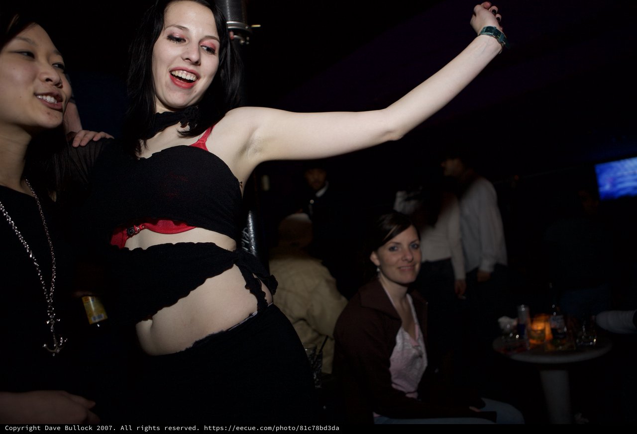 Woman Dancing Freely at Underground Nightclub Event