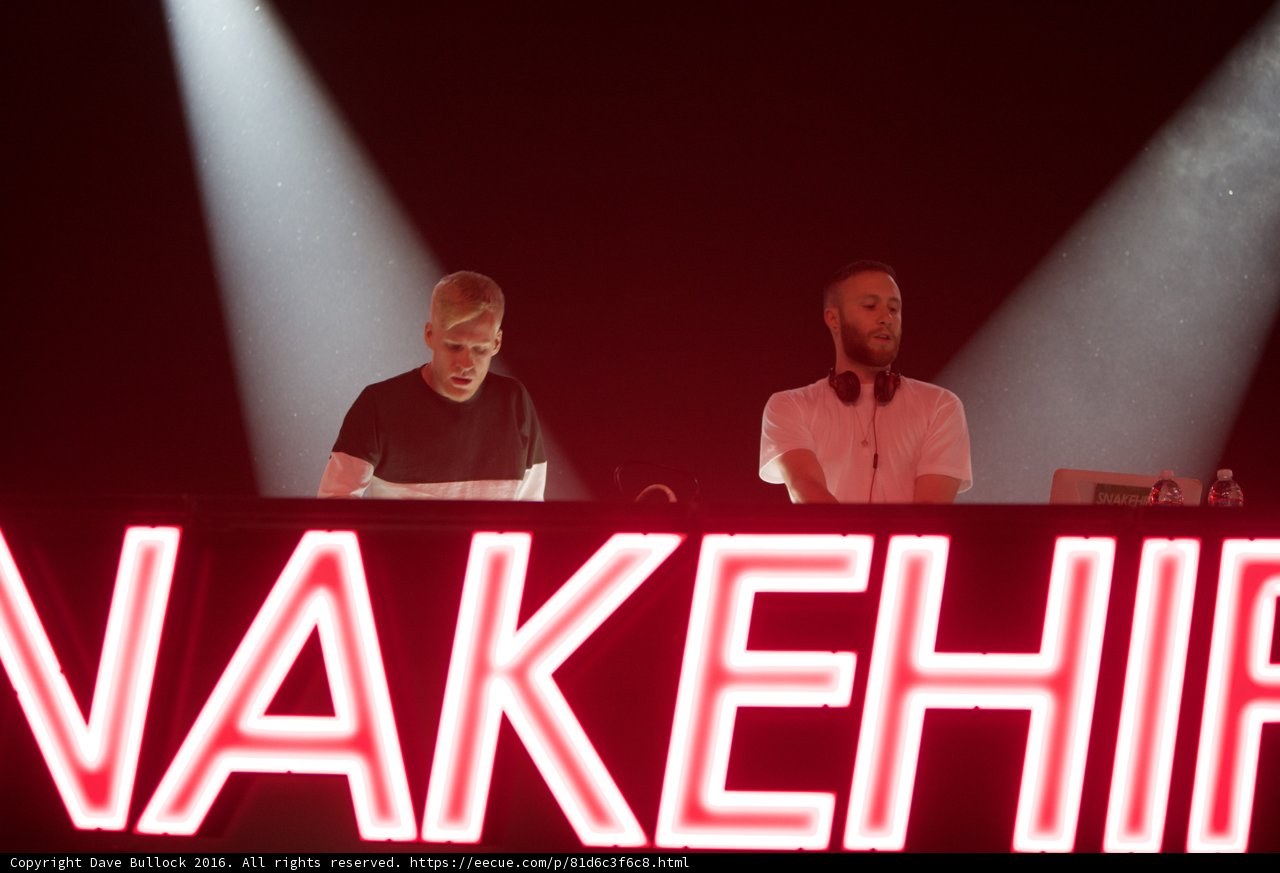 Neon Sign and Two Men at Coachella