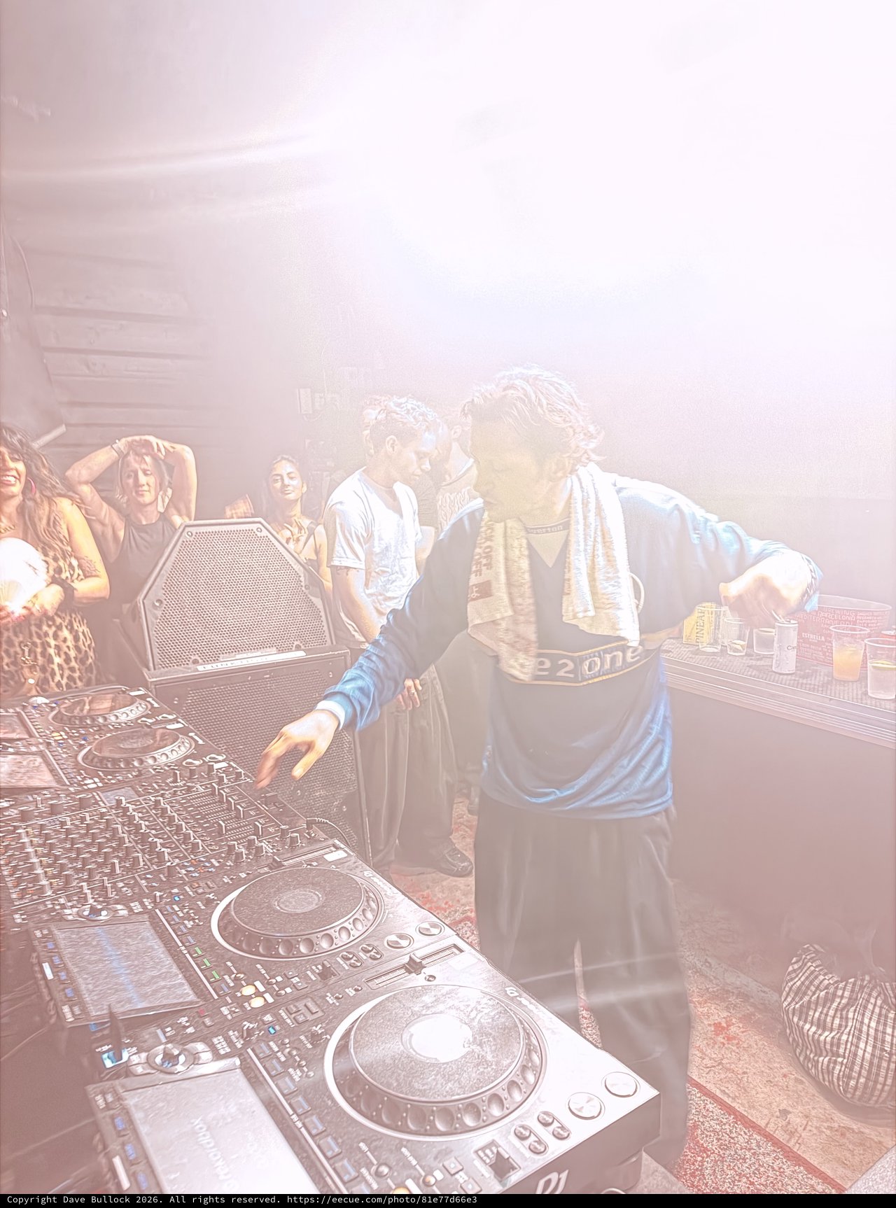 DJ Performance in Hazy Underground Club Atmosphere
