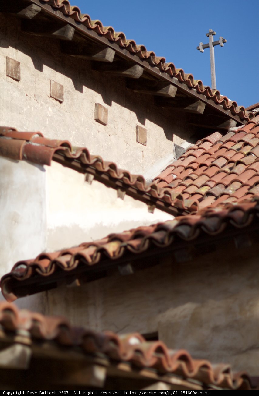 A Cross on a Traditional Tile Roof