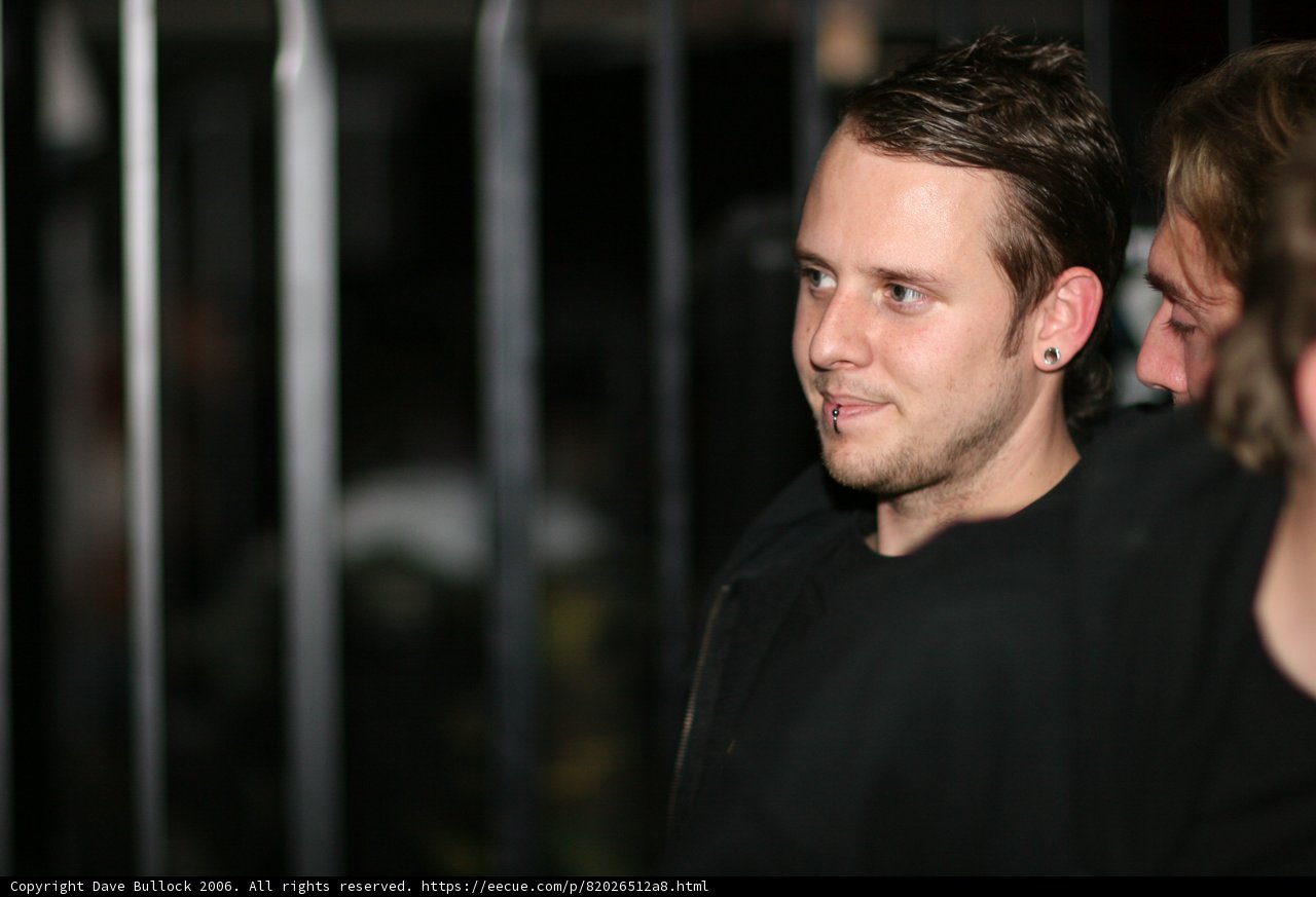 Smiling Man in Black Shirt