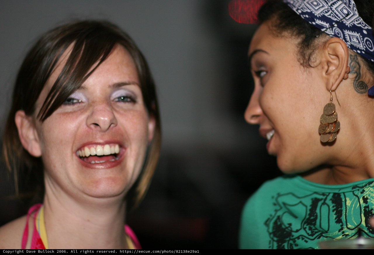 Two Women Share a Joyful Laughing Moment Together