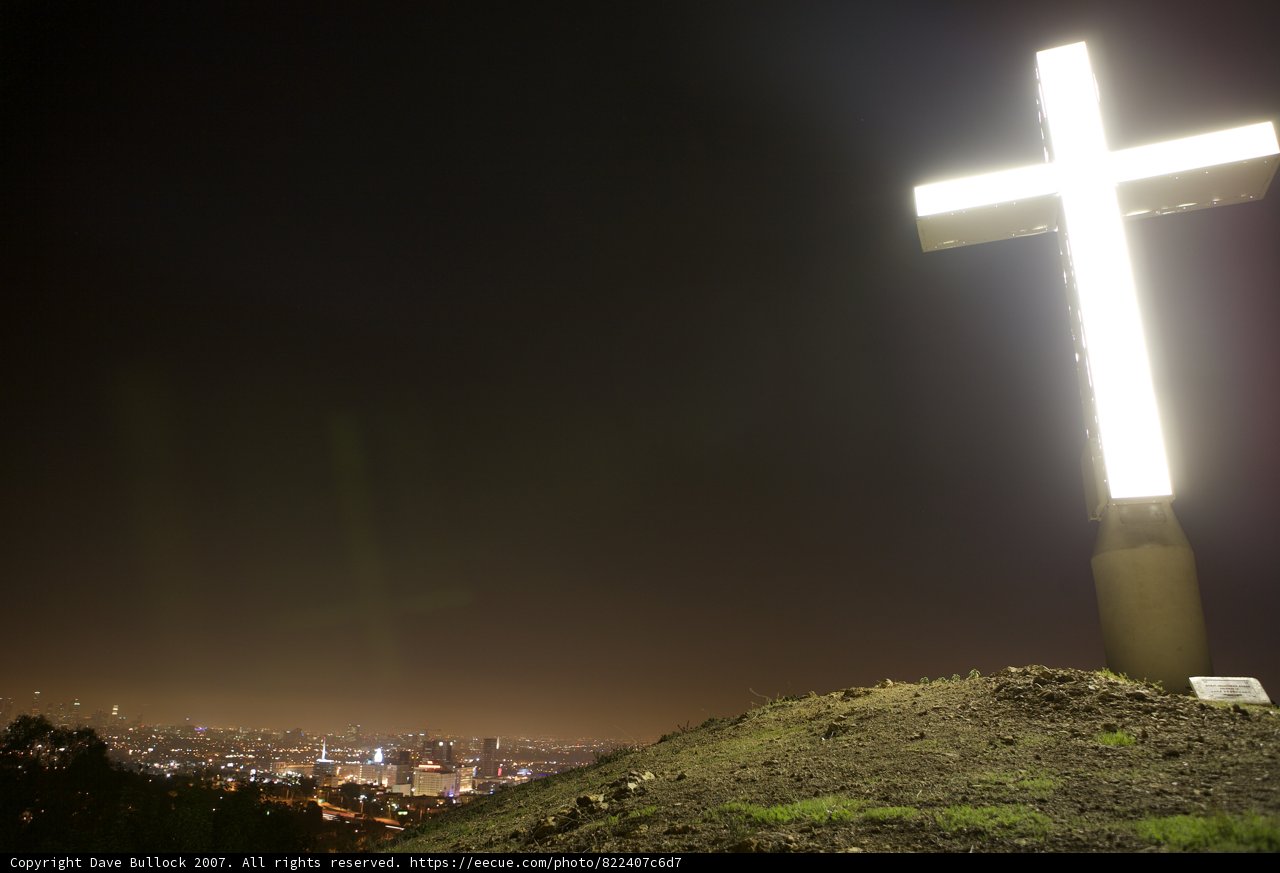 Illuminated Cross Atop the Hill
