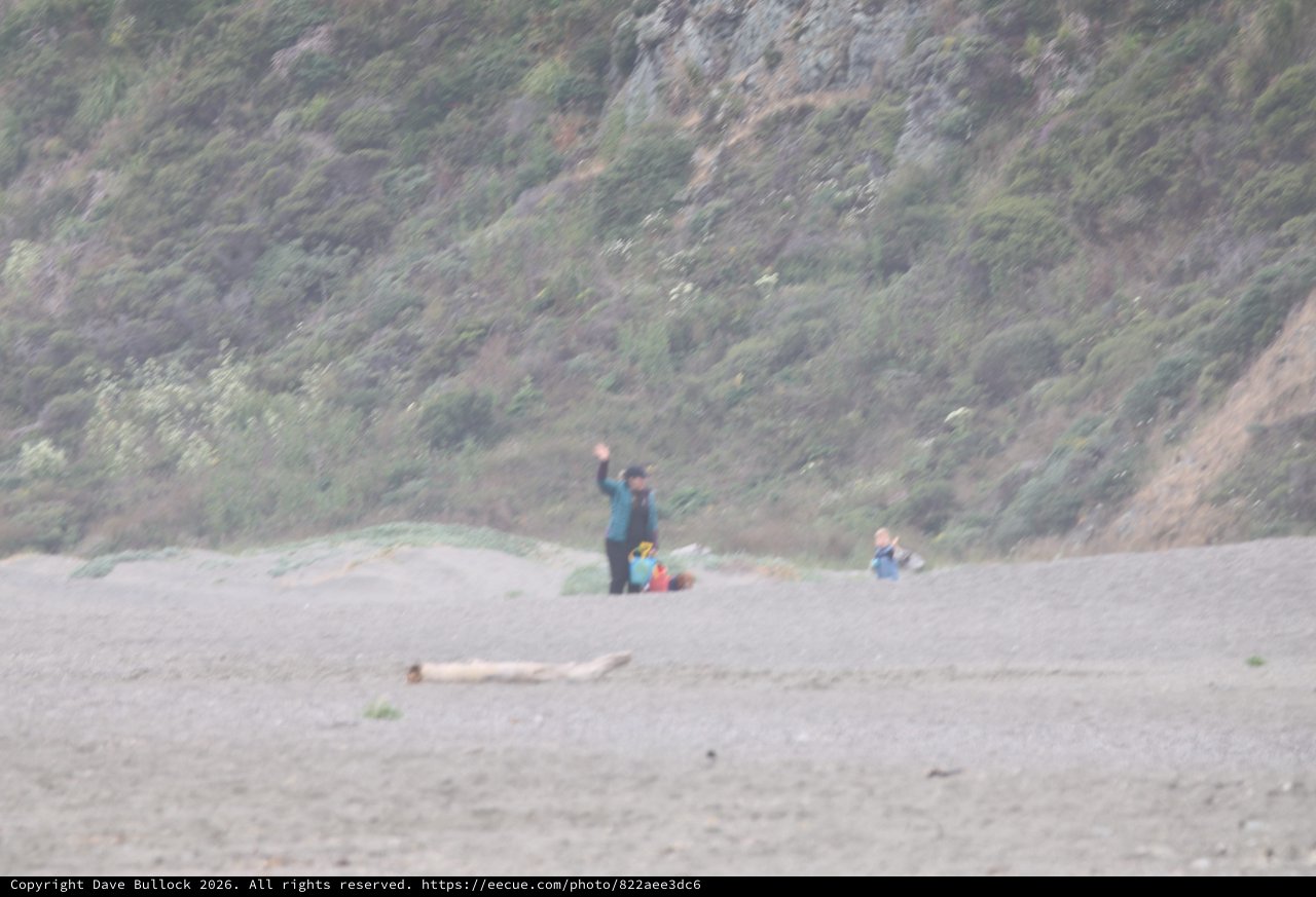 Waving Hello on a Misty Beach Camping Day