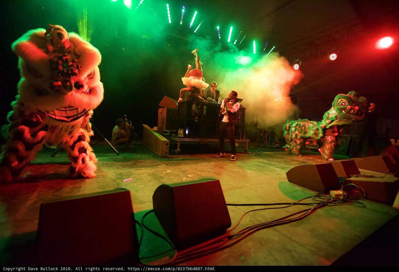 Stage Performance with Vibrant Green and Red Lights