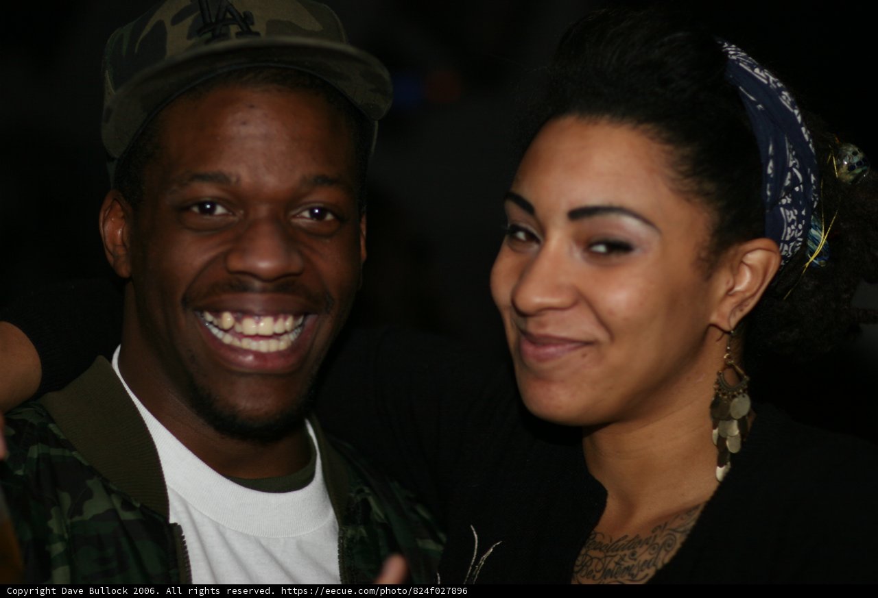 Smiling Couple with Baseball Hats