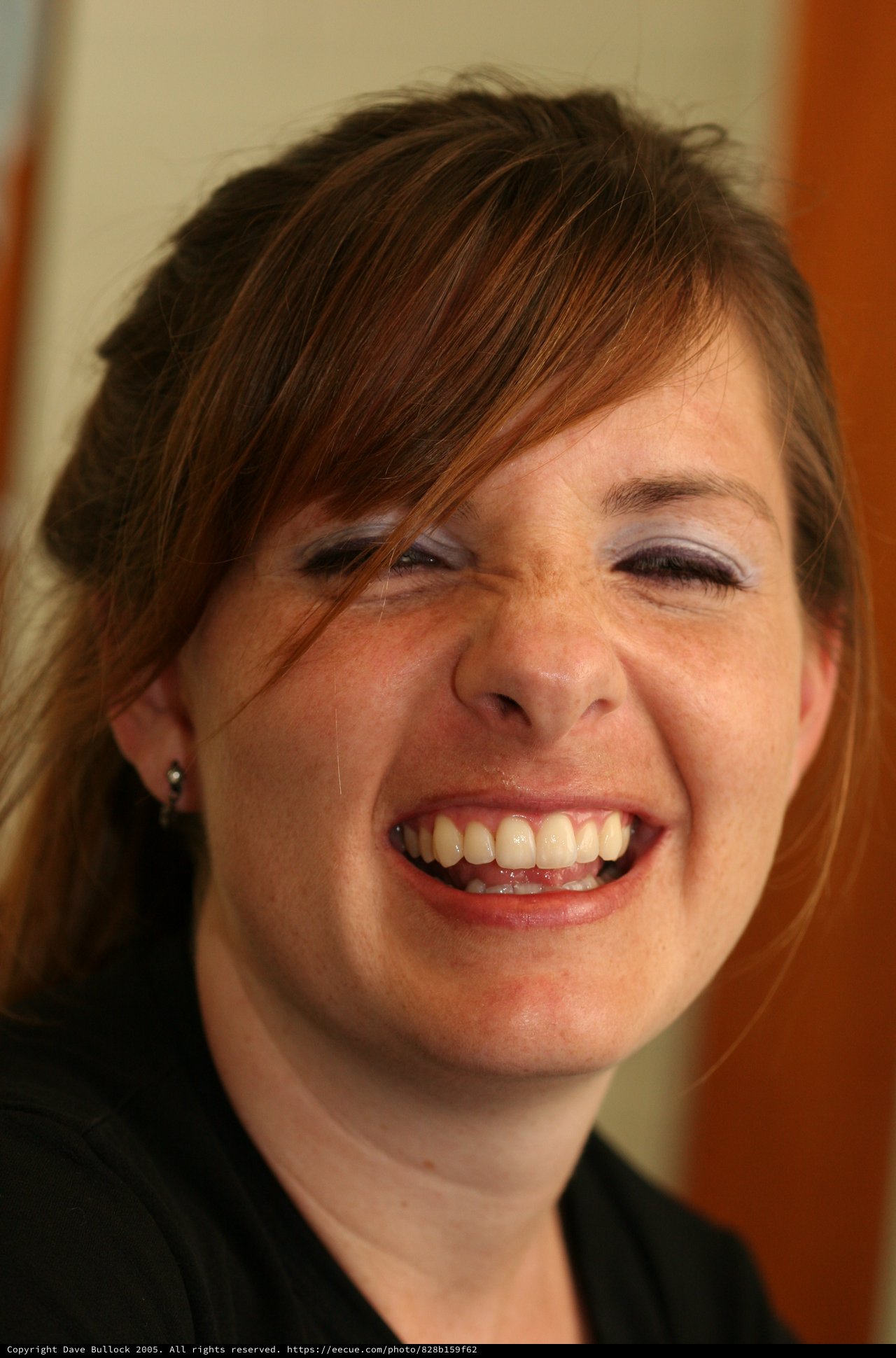 Joyful Woman Laughing with Eyes Closed