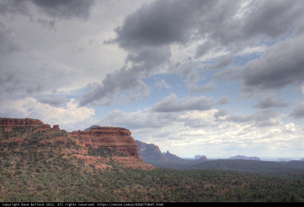 Majestic Red Rock Formation with Clouds Above