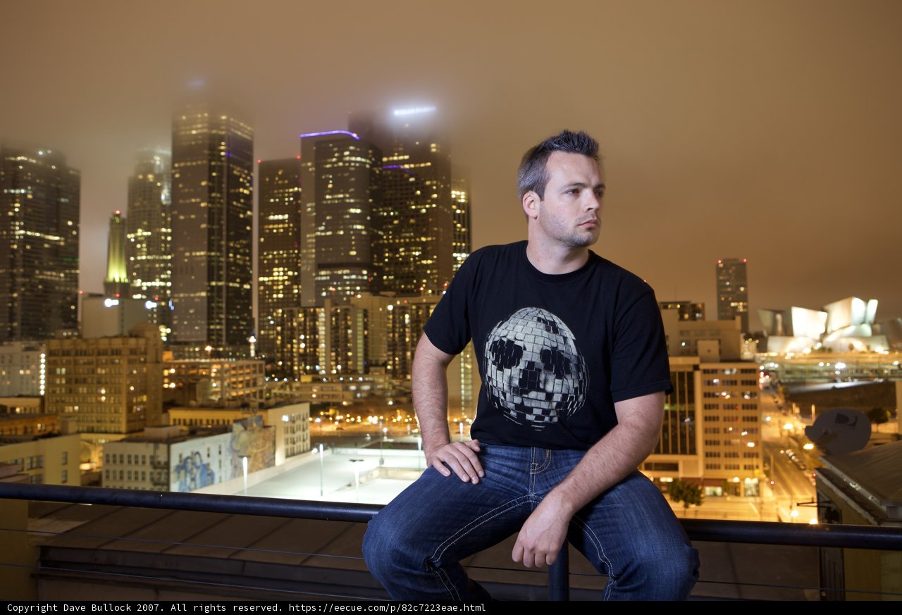 City Skyline Seated Man