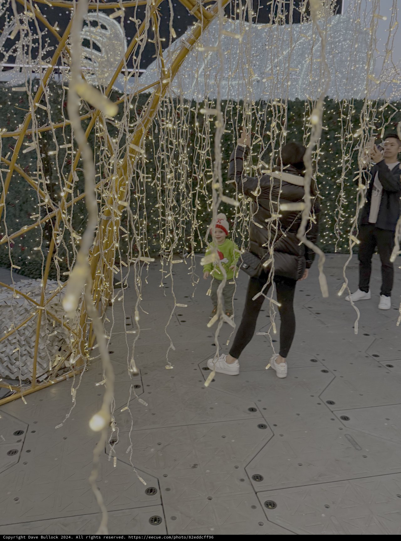 Children Playing in Illuminated Ribbon Installation