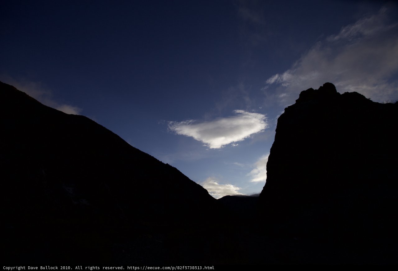 Majestic Cloud Formation Over Mountain Range