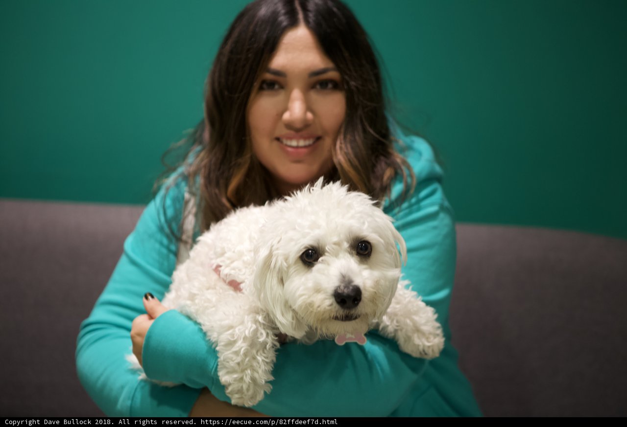 Woman and her white bichon-poodle mix