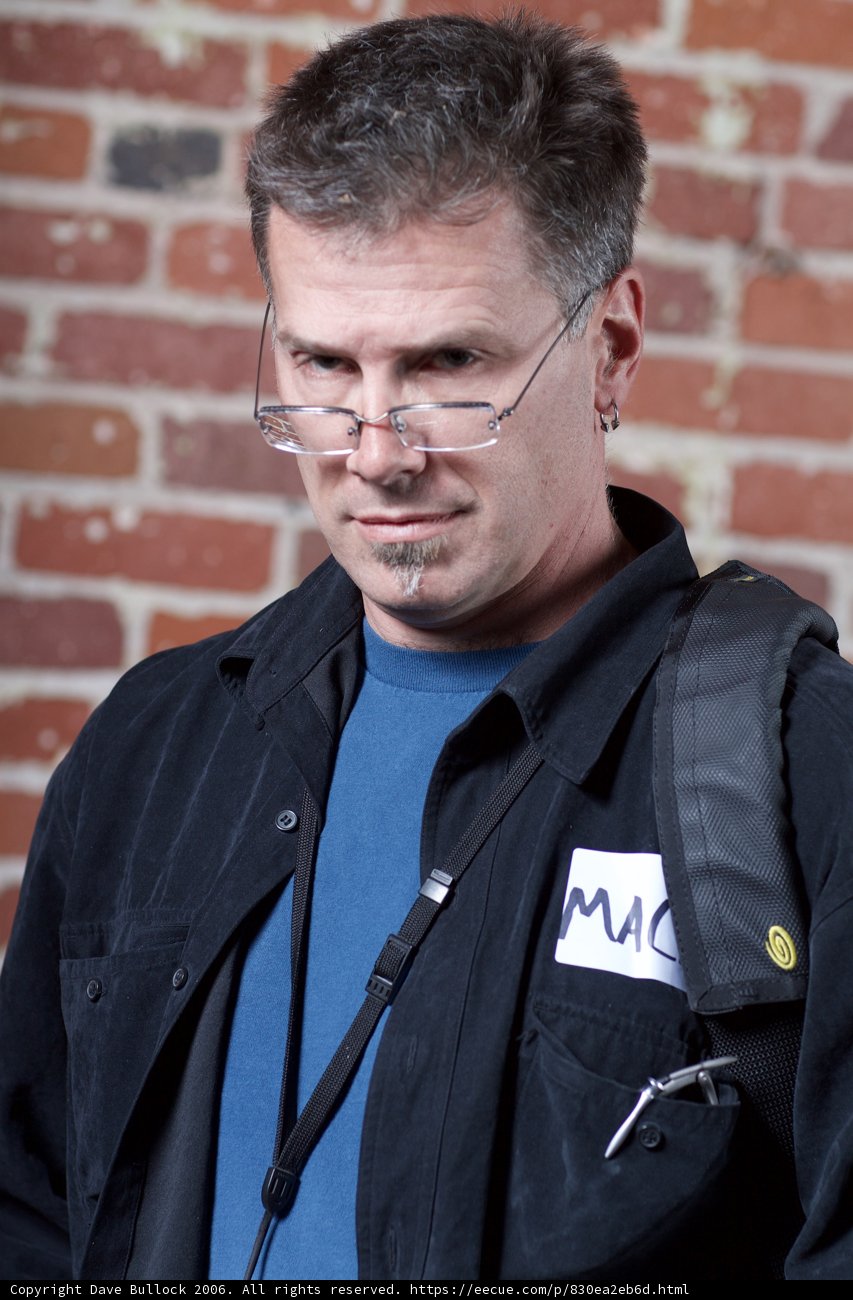 Man with Glasses and Black Jacket