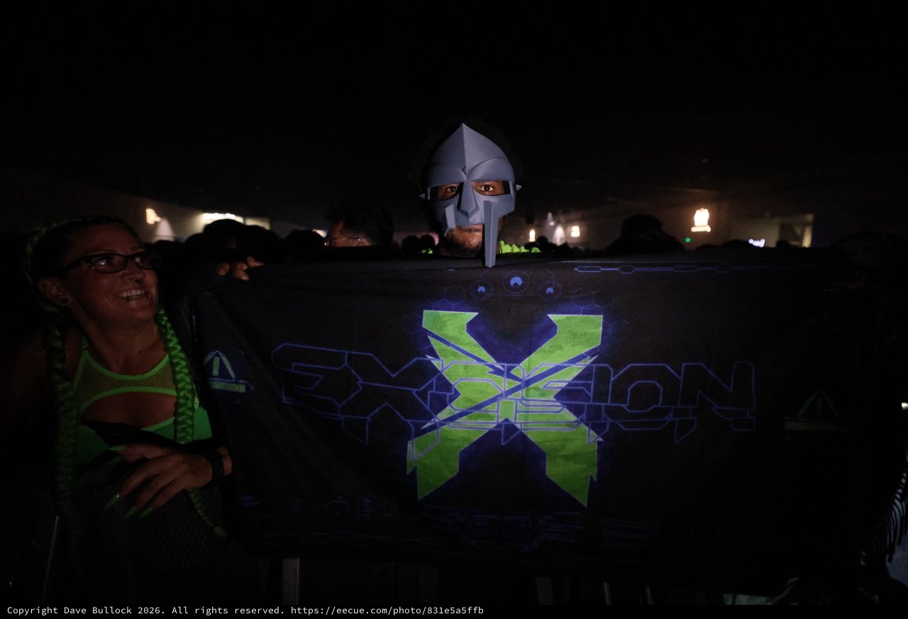 Masked DJ Peeks Over Exxion Banner at Wobbleland