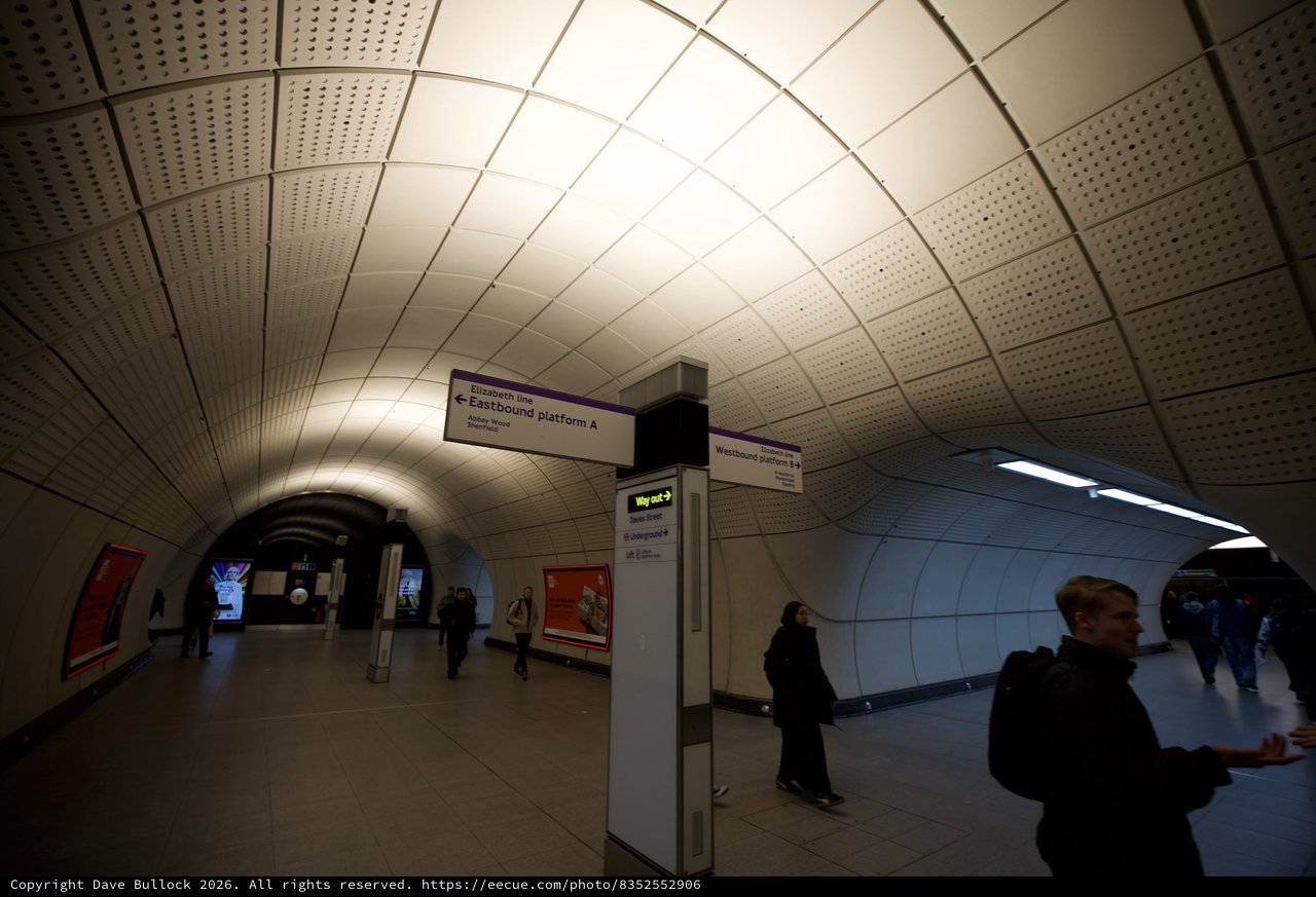 Underground Station Platform Directional Signage at Rush Hour