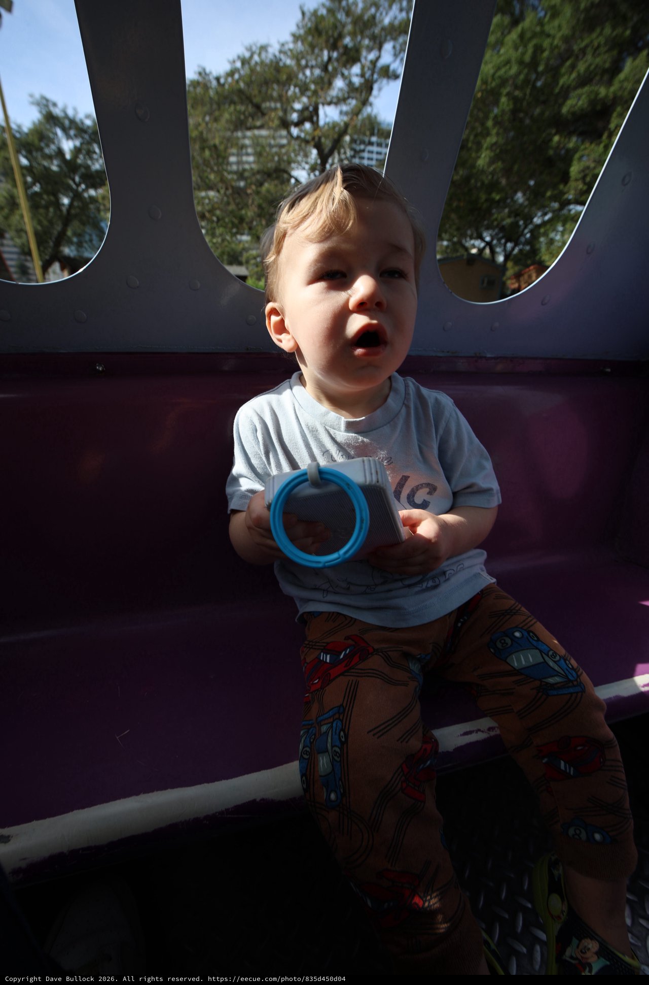 Toddler Playing with Blue Ring in Bounce House