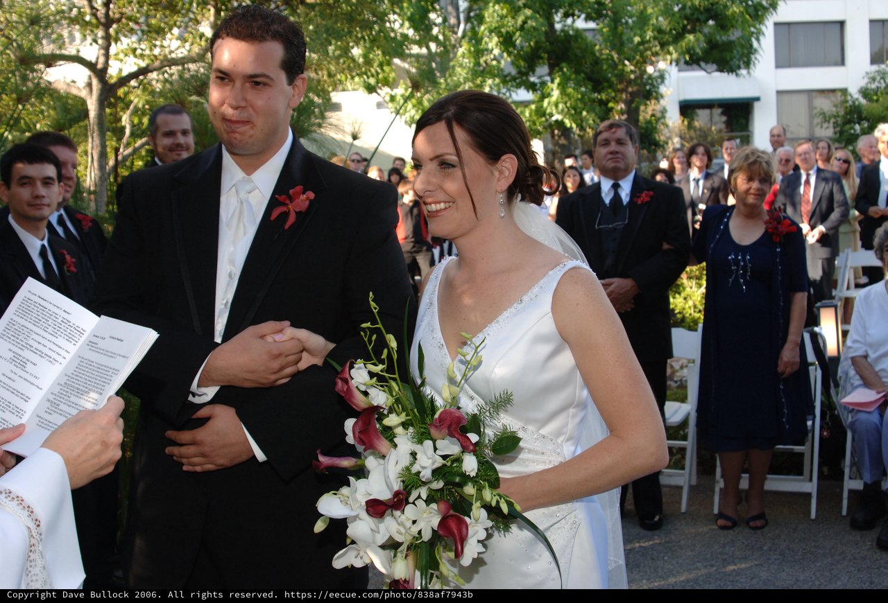 Bride and Groom Exchange Vows at Outdoor Ceremony
