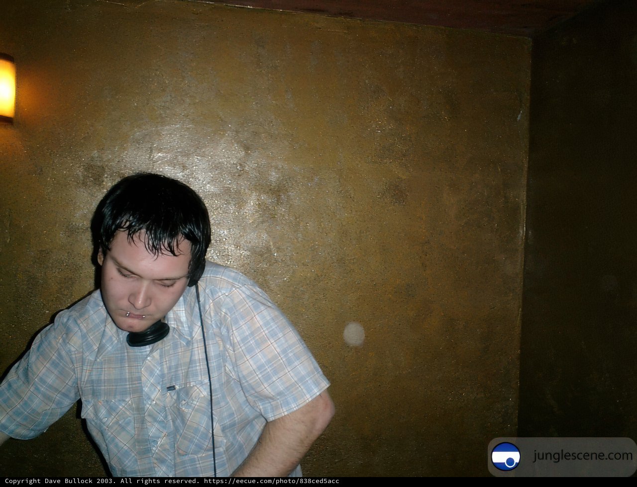 Jason W listening to music with black headphones