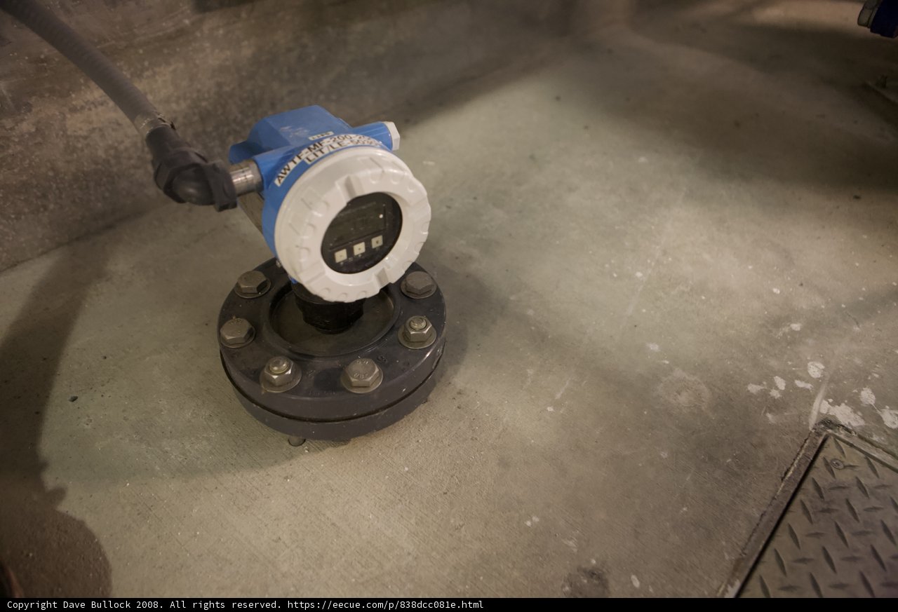 Blue and White Valve on Concrete Floor