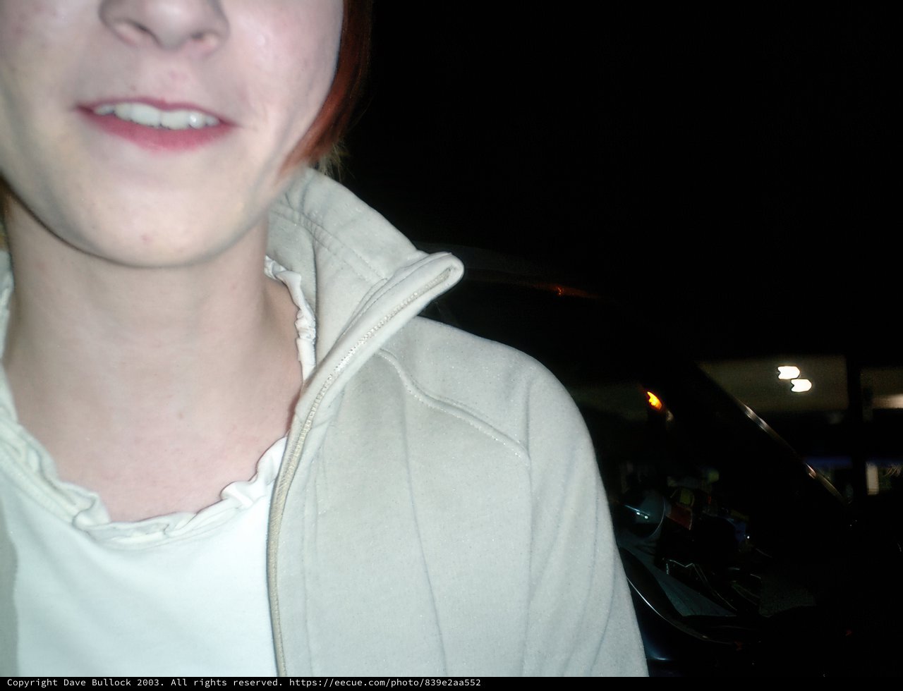 Red-haired Woman Smiling Under the Night Sky