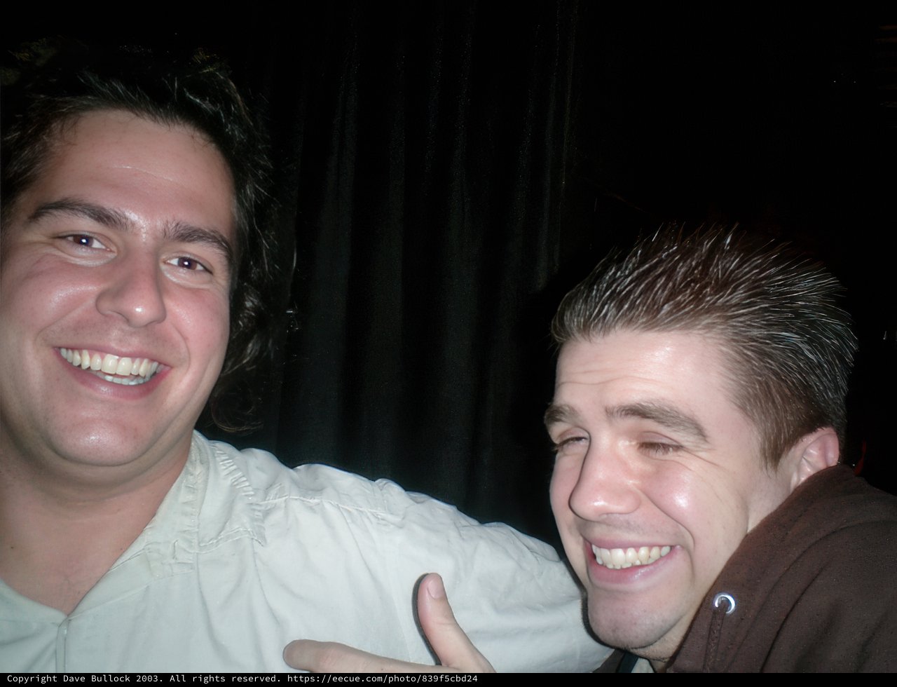 Two Men Grinning for the Camera