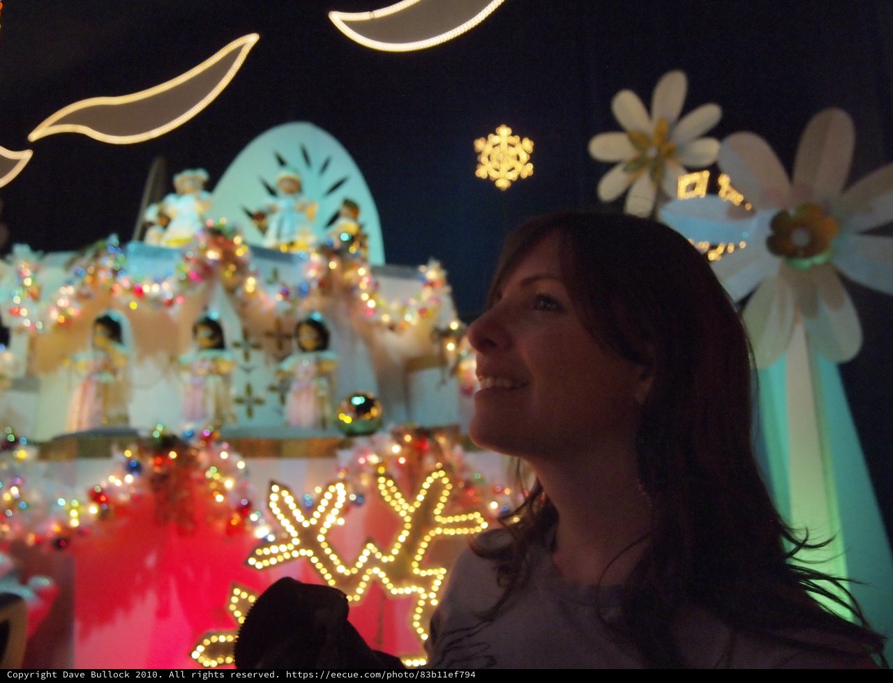 Woman Enjoying It's a Small World Holiday Display