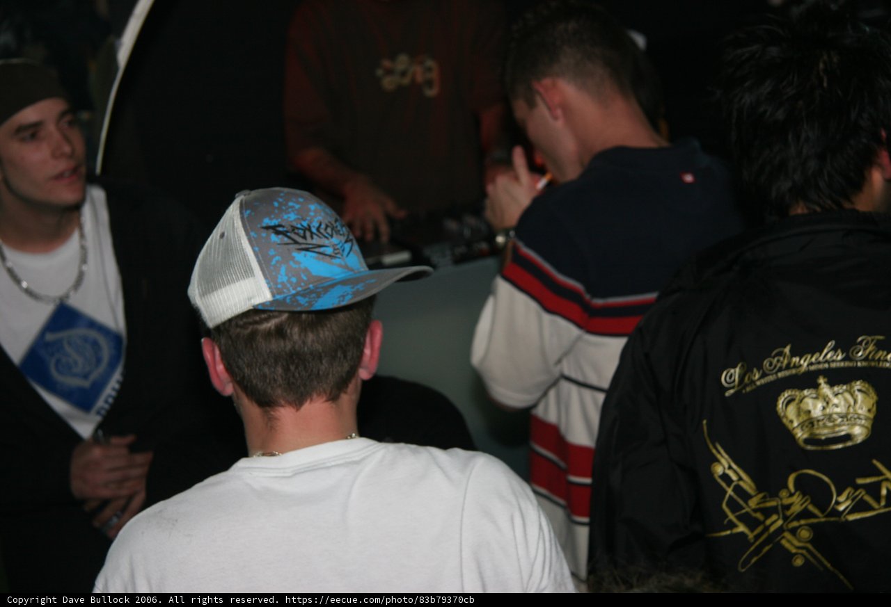 Man in White Shirt and Baseball Cap