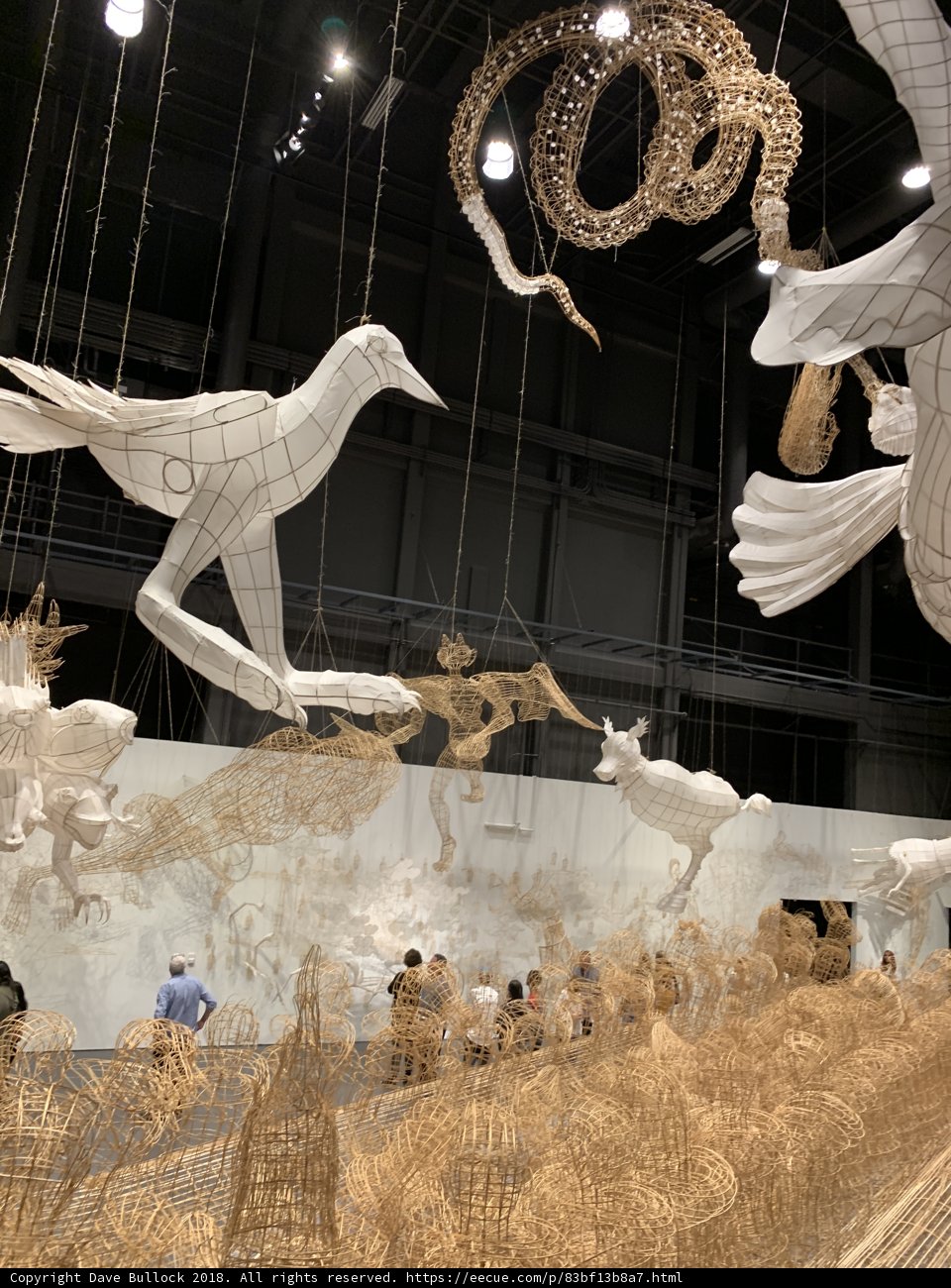 Group Admiring Majestic Sculpture