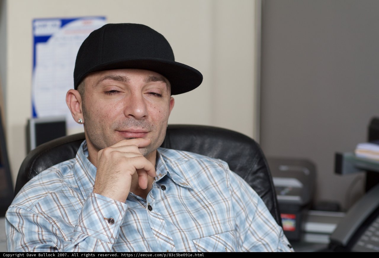 The Man in the Plaid Hat