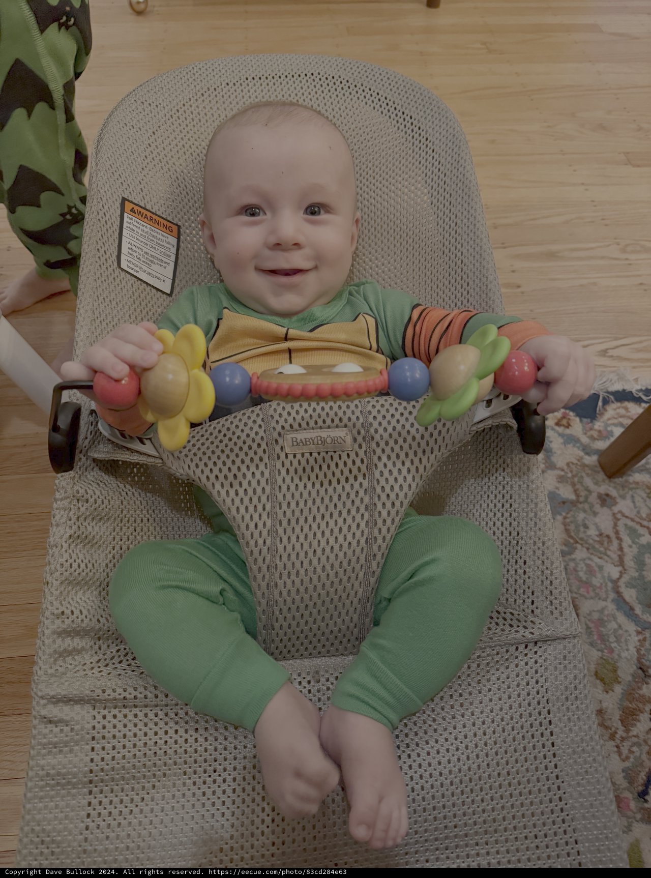 Happy Baby in Bouncy Seat with Toys