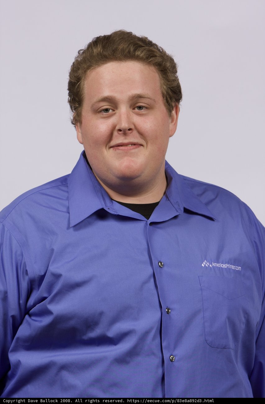 Blue-Shirted Man in Office
