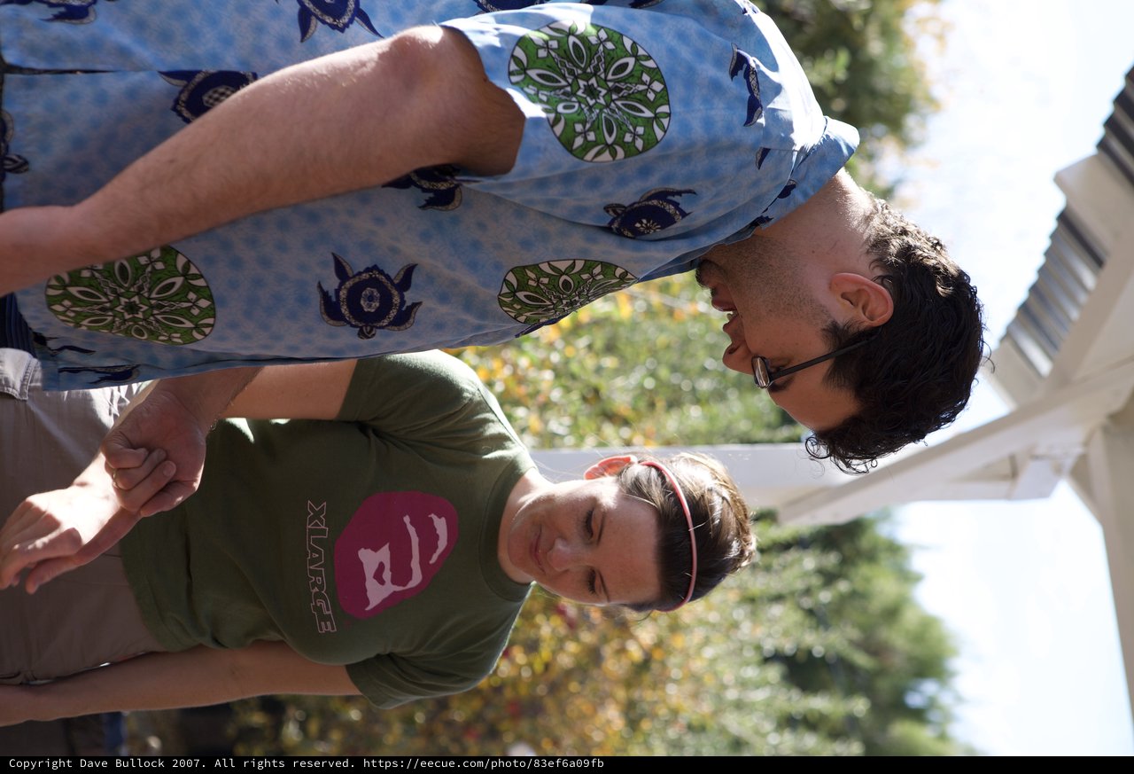 Two Friends Examine Something at Apple Farm