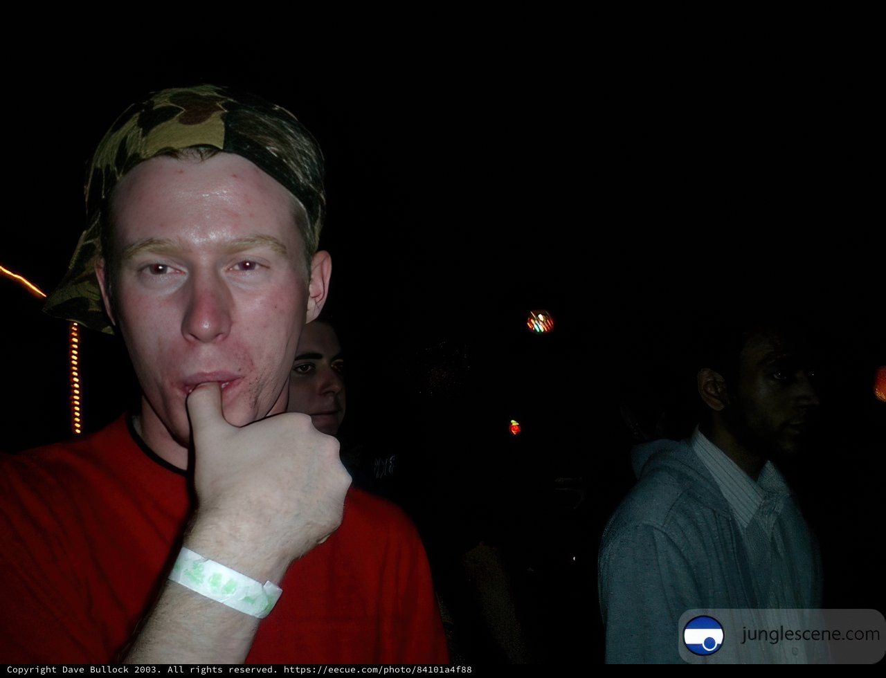 Shh, Don't Tell Caption: Jon Montgomery holds a finger to his lips while out with friends Pete G and another man on a night out in the city in 2003. Notice the stylish bracelets and rings they wear.