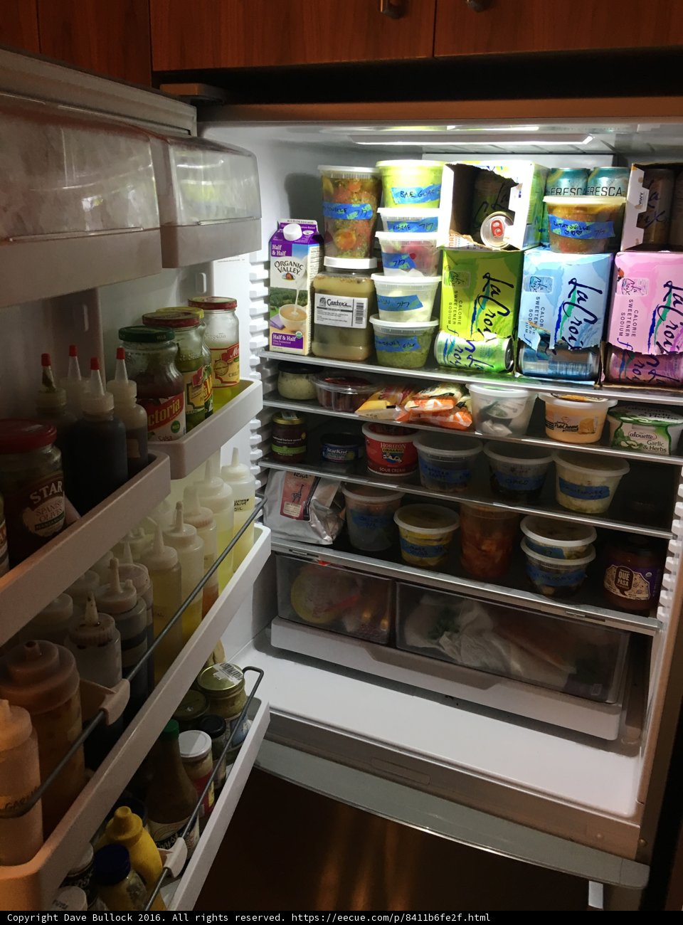 Refrigerator stocked with fresh groceries