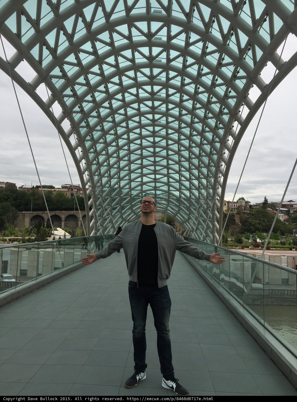 Arms Wide on Bridge of Peace