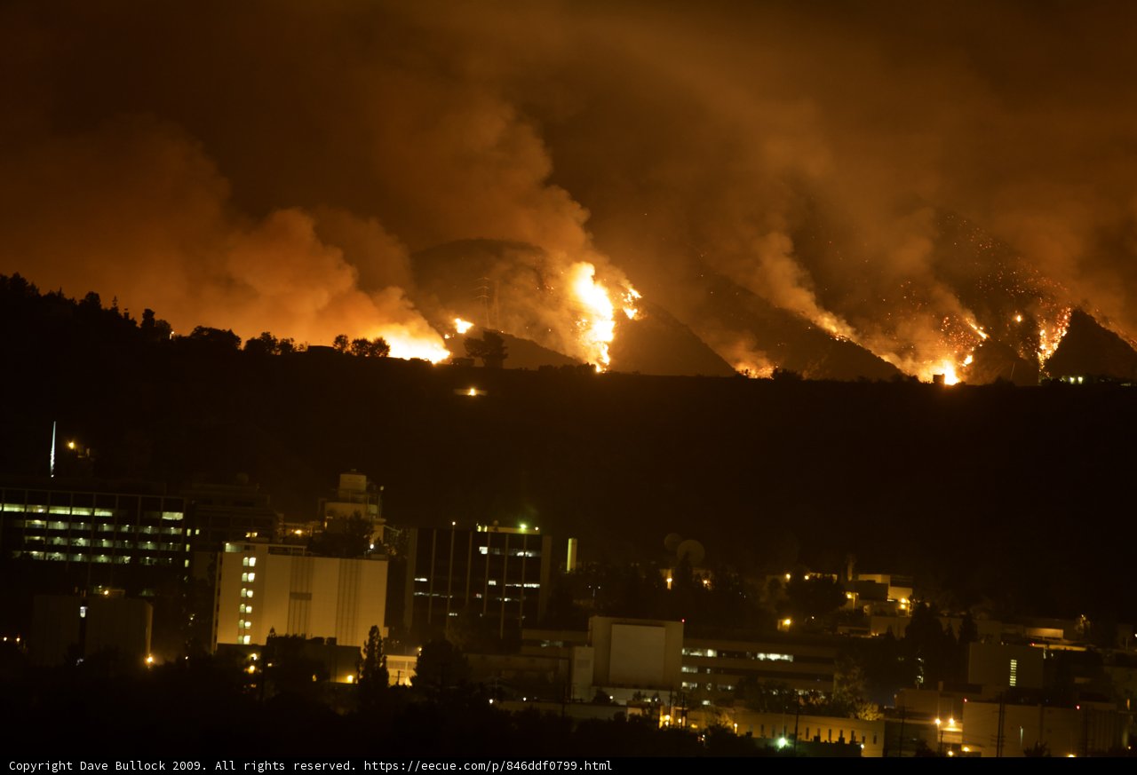 Flames Engulf Hills Above City