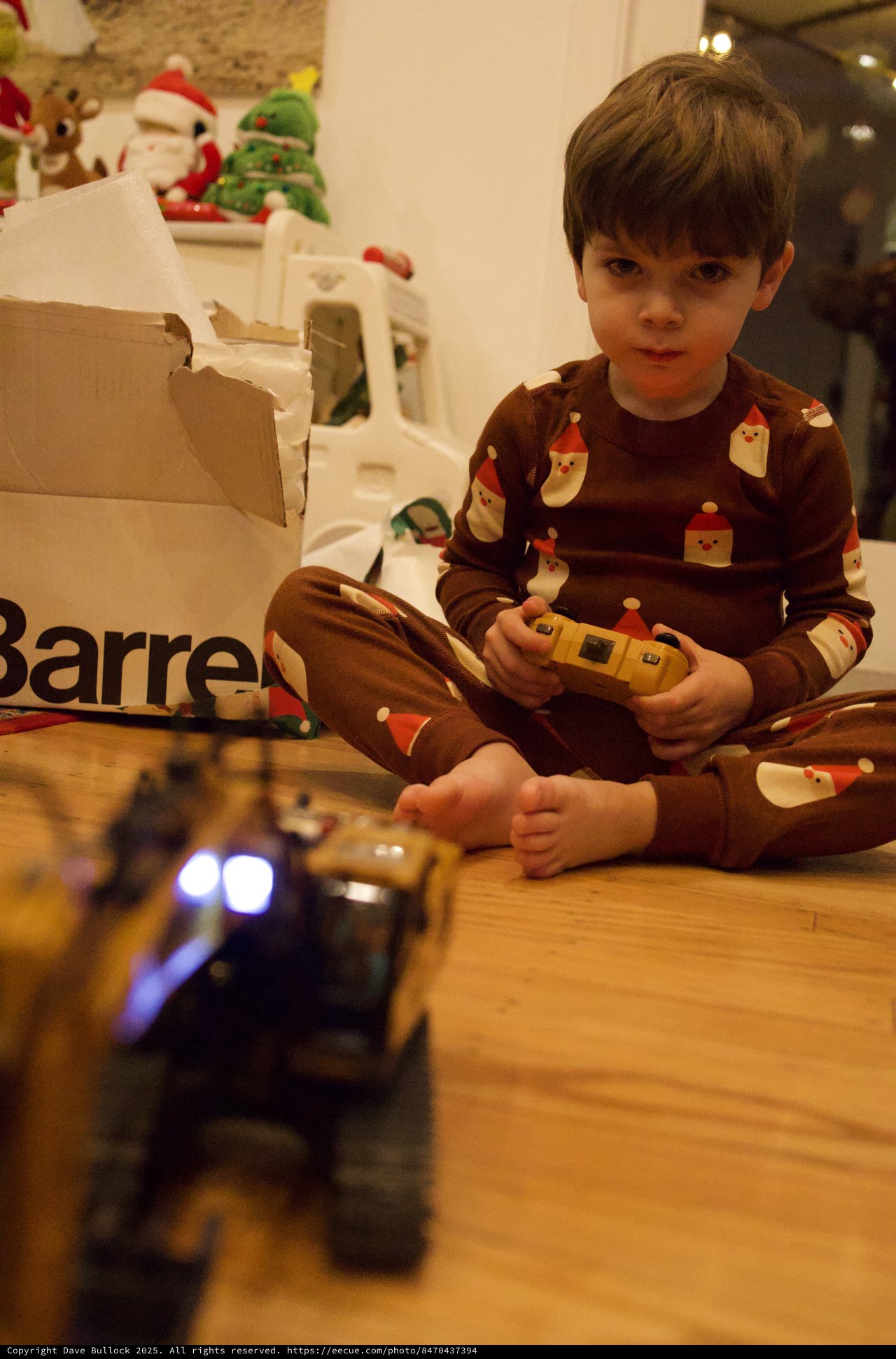 Young Boy Playing with Remote Control Toy on Christmas Morning