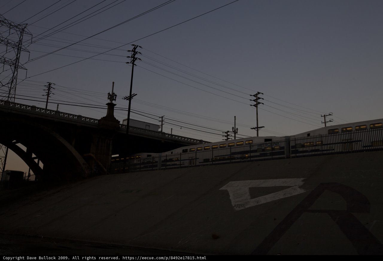 Dusk Train under the Freeway Bridge