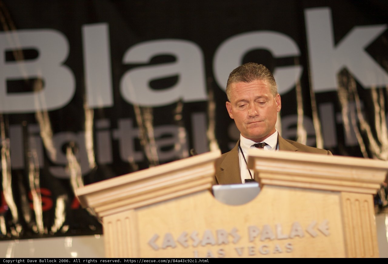 A Man in a Suit and Tie Addressing a Crowd