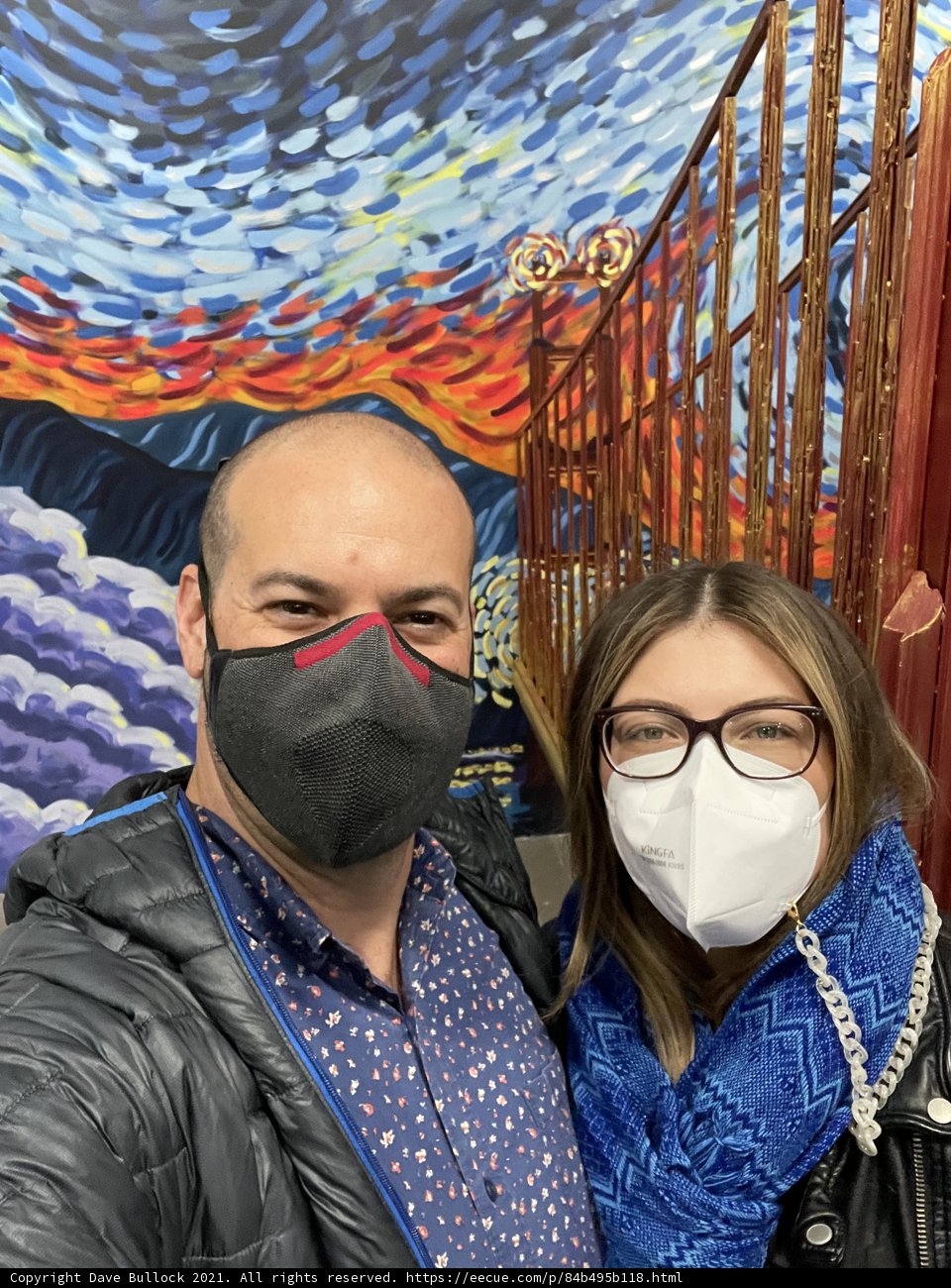 Masked in Front of Mural
