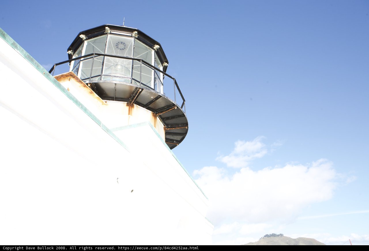 Iconic White Lighthouse with B&W Roof