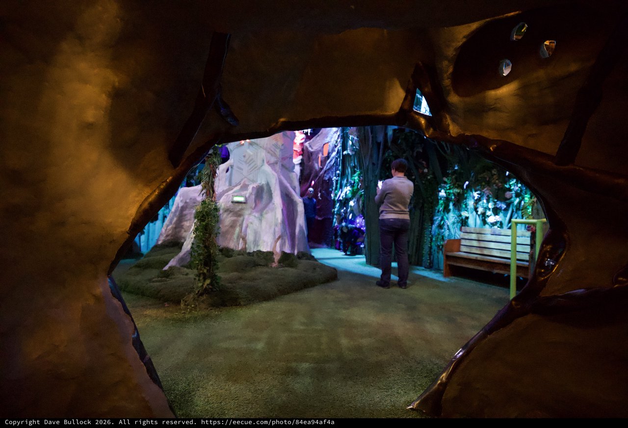 Cave-Like Museum Installation with Colorful Crystal Displays